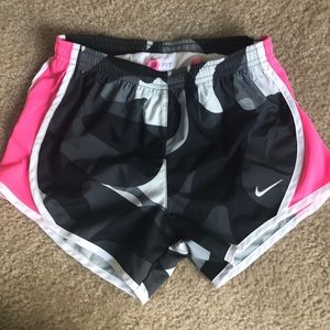pink,black, and white nike shorts